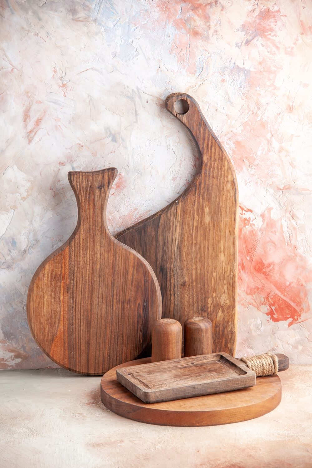 A collection of wooden cutting boards of various shapes and sizes, as wooden gift idea for Christmas